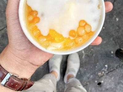 Cup of sweet dessert held on Bui Vien Street, Saigon