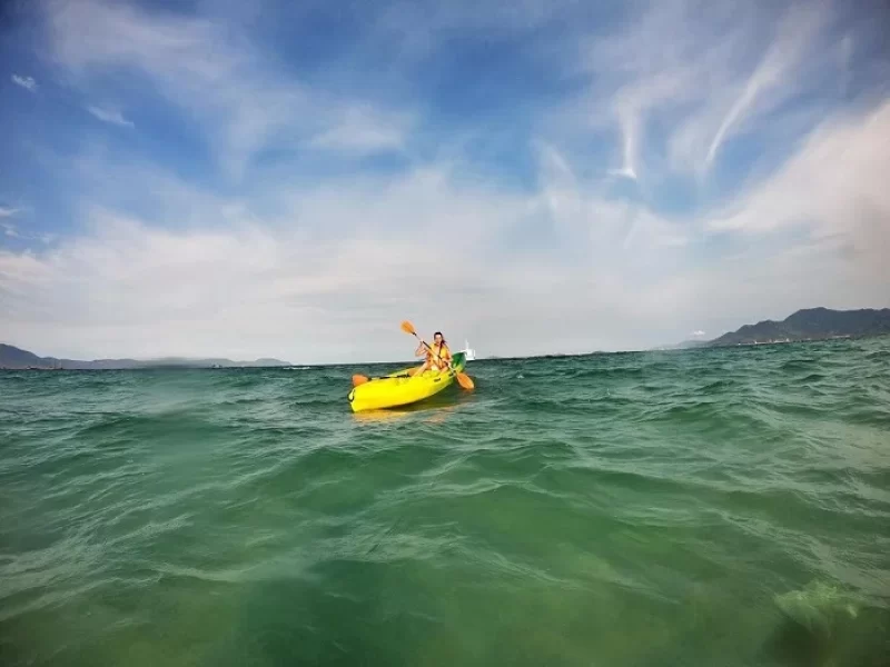 Doc Let Beach: An Idyllic Paradise in Khanh Hoa Person relaxing on a yellow float at Doc Let Beach