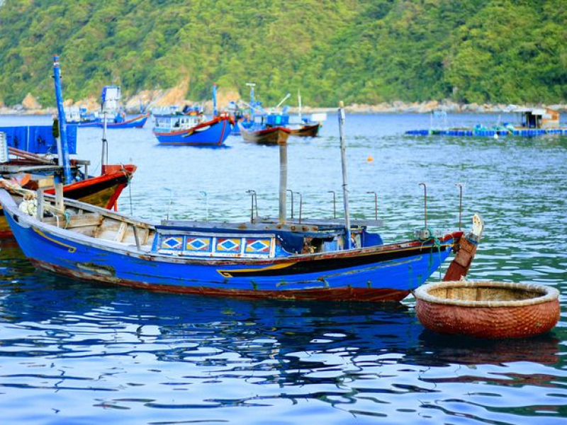 Doc Let Beach: An Idyllic Paradise in Khanh Hoa Blue fishing boats and a basket boat near Doc Let Beach