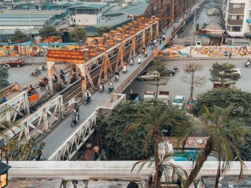 Motorbikes crossing Long Bien Bridge in Hanoi