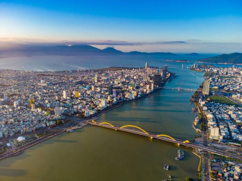 Ha Long Bay to Da Nang: Transport Guide for a Smooth Trip Aerial view of Da Nang city and the Han River bridges