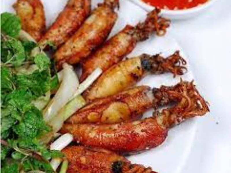 Discover Peaceful Quan Lan Island in Halong Bay Grilled squid with fresh herbs on Quan Lan Island