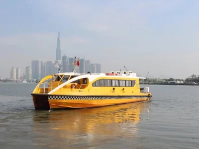 Saigon River: Explore Ho Chi Minh City by Boat Yellow water bus on the Saigon River with the city skyline