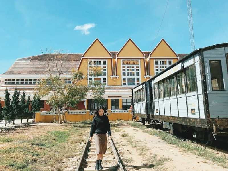 Trai Mat Farm: Dalat's Enchanted Retreat Traveler beside the old train at Dalat Railway Station