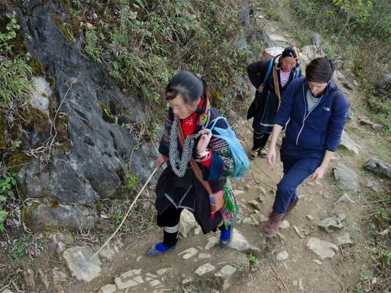 Trekking in Sapa: What You Need to Know Trekkers hiking a rocky trail near Sapa