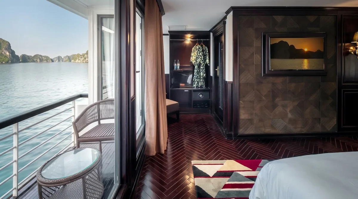 Ambassador Cruise: Luxury Experience on Halong Bay Waters - Ambassador Premium | Vietnam Discovery Tours Luxurious Ambassador Premium cabin with twin beds private balcony and panoramic ocean view of Halong Bay