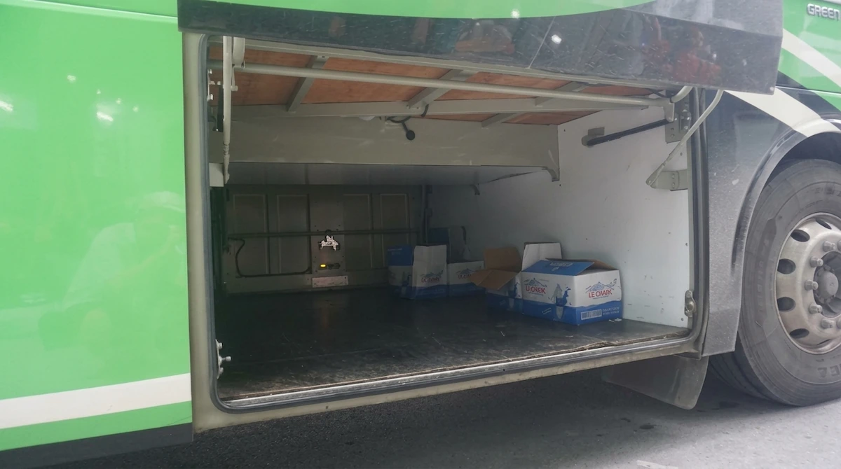 Sapa to Ha Long VIP Sleeper Bus Luggage Storage | Vietnam Discovery Tours Spacious luggage compartment of Sapa to Ha Long VIP sleeper bus for passenger baggage storage