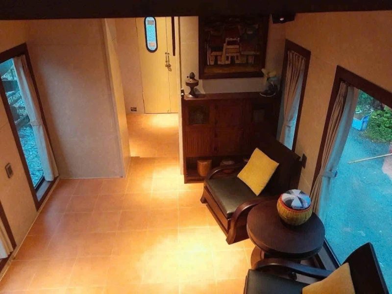 Warm train cabin with soft light and cozy seats.