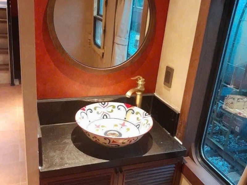  Elegant train sink with floral ceramic basin.