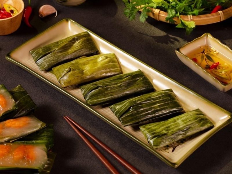 Banh nam flat rice dumplings wrapped in banana leaves, a Hue specialty