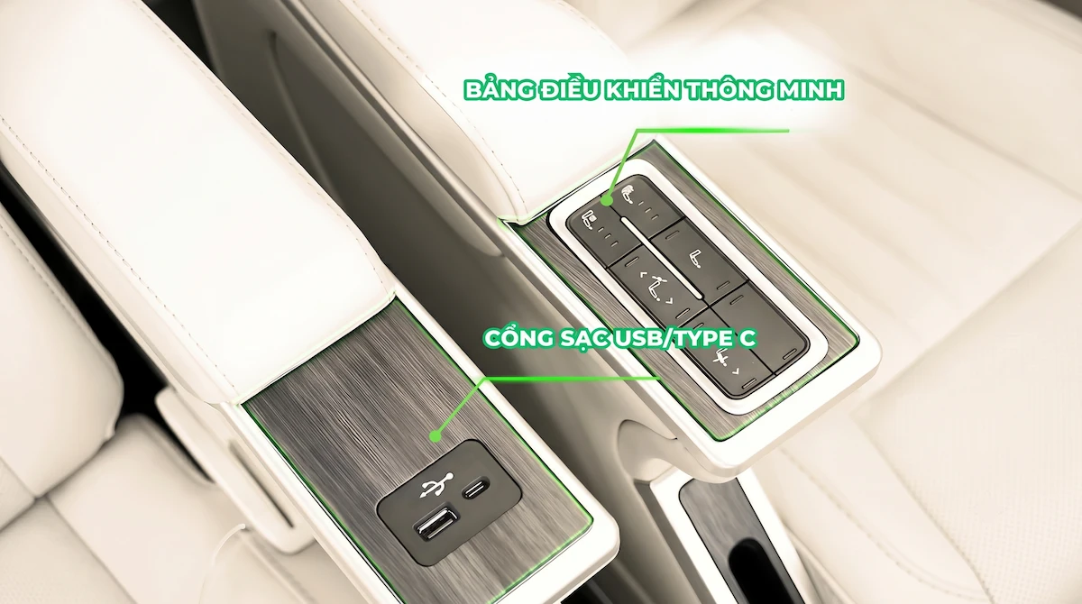 Close-up shot of the luxury leather armrest inside the Hanoi to Sapa VIP limousine bus, highlighting the electronic reclining control panel and integrated USB/Type-C device charging ports provided by Vietnam Discovery Tours. Smart armrest control panel with seat recline buttons and USB Type C charging ports on VIP limousine bus to Sapa by Vietnam Discovery Tours