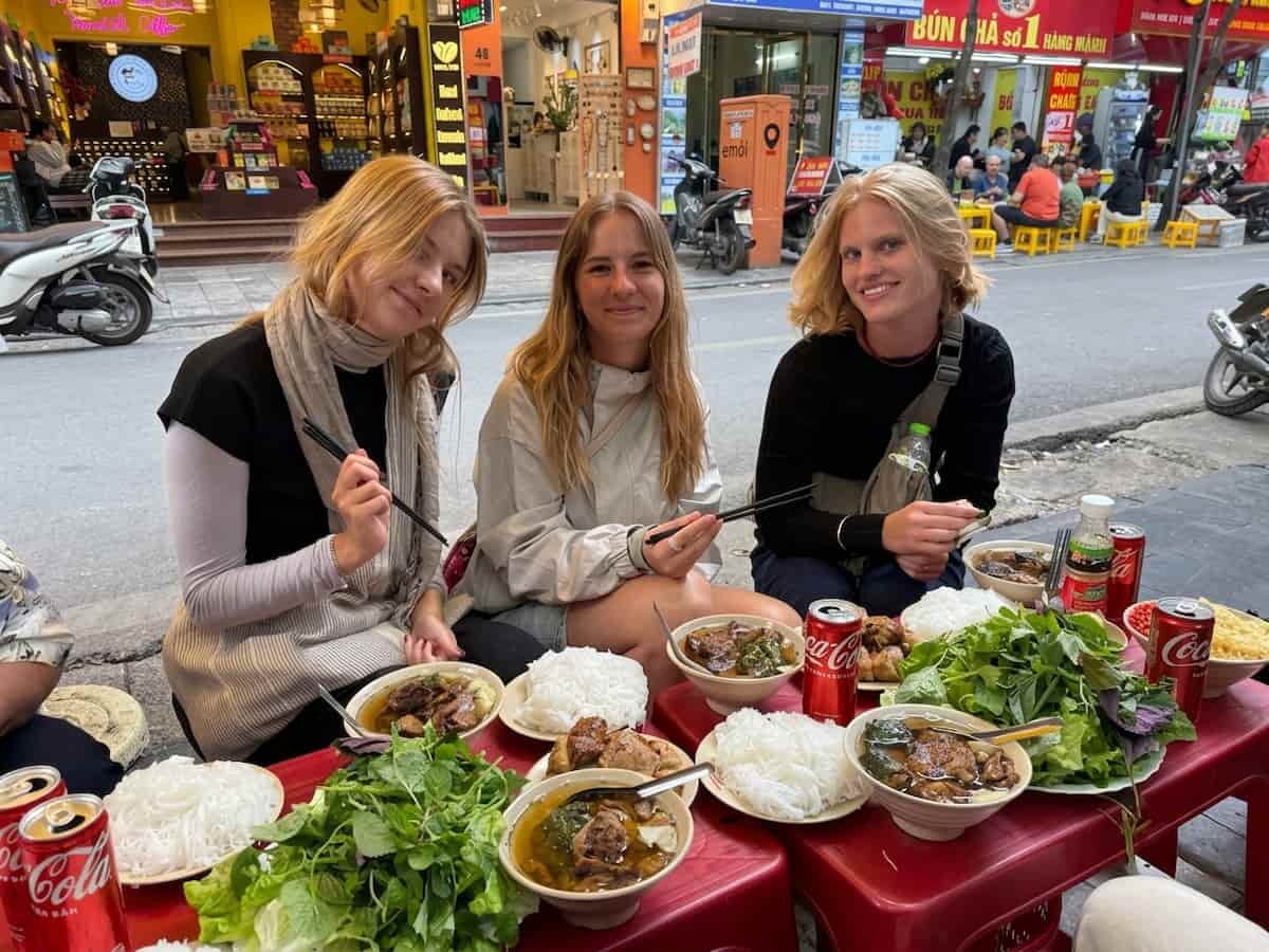Travelers enjoying meals at top 5 best bun cha restaurants in Hanoi