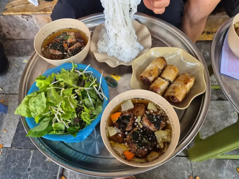 Top 5 Best Bun Cha Restaurants in Hanoi You Must Try Storefront of Bun Cha 41 Cua Dong restaurant in Hanoi Old Quarter, recommended by Vietnam Discovery Tours.