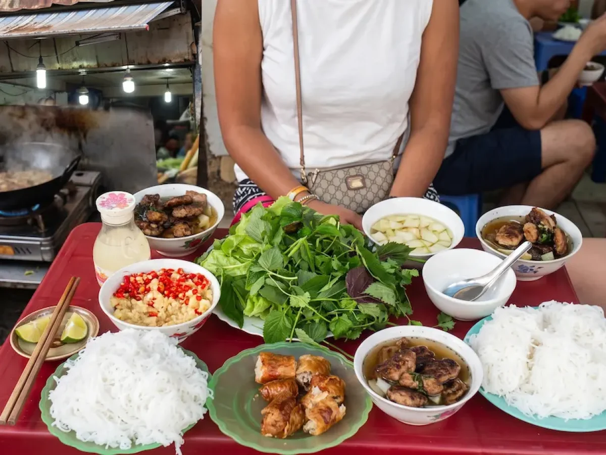 A hearty and savory portion of Bun Cha Dac Kim served in Hanoi | Photo: Vietnam Discovery Tours Generous serving of Bun Cha Dac Kim with crispy crab spring rolls, grilled pork, and noodles - Vietnam Discovery Tours
