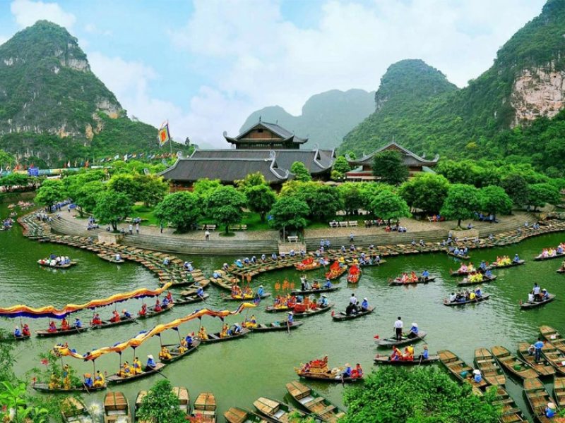Trang An temple complex Aerial view of a temple complex at Trang An surrounded by tourist and festival boats, Ninh Binh
